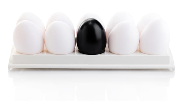 black and white chicken eggs on a white background