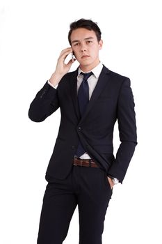 A young caucasian male businessman looking unhappy holding a mobile phone looking at camera.