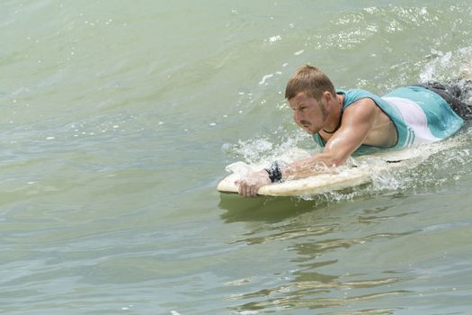 Man Body Boarder surfing on the waves Sea beach