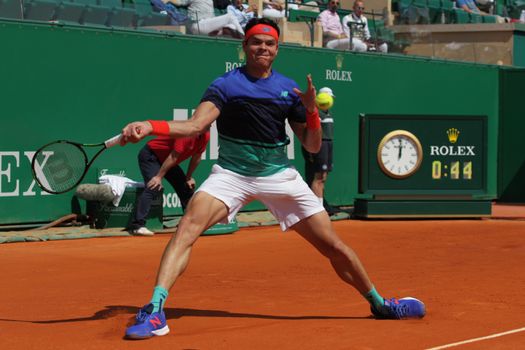 MONACO, Monte-Carlo: Canada's Milos Raonic hits a return to Britain's Andy Murray during their tennis match at the Monte-Carlo ATP Masters Series tournament on April 15, 2016 in Monaco. Britain's Andy Murray is through to the Monte Carlo Masters semi-finals following an impressive win over Canadian Milos Raonic.