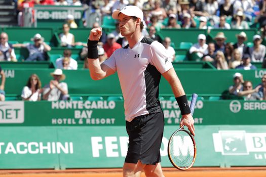 MONACO, Monte-Carlo: Britain's Andy Murray raises his fist in sign of victory during his  tennis match with Canada's Milos Raonic at the Monte-Carlo ATP Masters Series tournament on April 15, 2016 in Monaco. Britain's Andy Murray is through to the Monte Carlo Masters semi-finals following an impressive win over Canadian Milos Raonic.