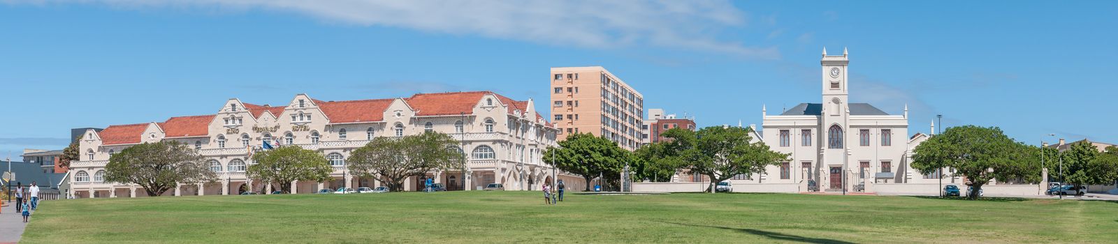 PORT ELIZABETH, SOUTH AFRICA - FEBRUARY 27, 2016: The historic King Edward Hotel, built in 1903, and the historic Old Grey Institute, built in 1858. The clock tower was added in 1875