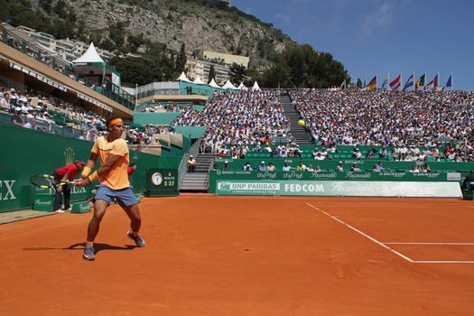 MONACO, Monte-Carlo: Spain's Rafael Nadal returns a shot to Switzerland's Stan Wawrinka during their tennis match at the Monte-Carlo ATP Masters Series tournament on April 15, 2016 in Monaco. 