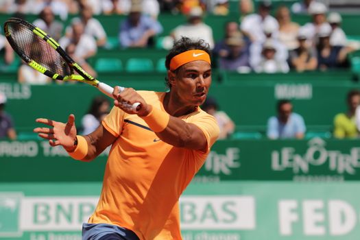 MONACO, Monte-Carlo: Spain's Rafael Nadal returns a shot to Switzerland's Stan Wawrinka during their tennis match at the Monte-Carlo ATP Masters Series tournament on April 15, 2016 in Monaco. 