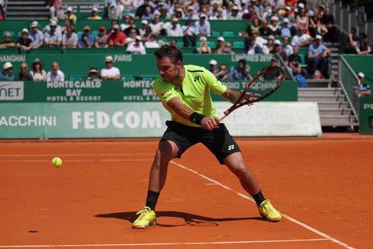 MONACO, Monte-Carlo: Switzerland's Stan Wawrinka returns a shot to Spain's Rafael Nadal during their tennis match at the Monte-Carlo ATP Masters Series tournament on April 15, 2016 in Monaco. 