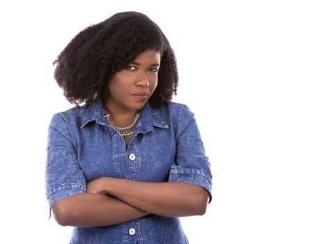 beautiful young black woman is wearing jean dress on white background