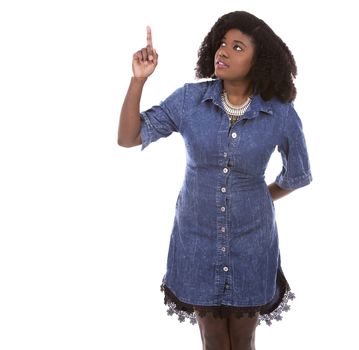 beautiful young black woman is wearing jean dress on white background