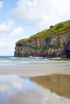 lone kayaker near the cliffs of ballybunion beach on the wild atlantic way ireland