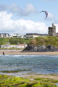 lone kite surfer playing the waves at ballybunion beach on the wild atlantic way
