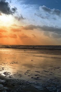 lone surfer surfing the winter waves at ballybunion beach on the wild atlantic way