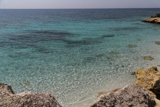 Beautiful turquoise sea water on coast of Is Arutas in Sardinia island, Italy