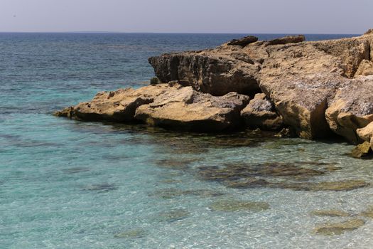 Beautiful turquoise sea water on coast of Is Arutas in Sardinia island, Italy