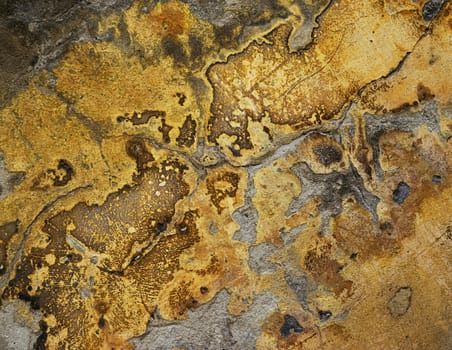 abstract background or texture Detail of an old yellow of wet plaster