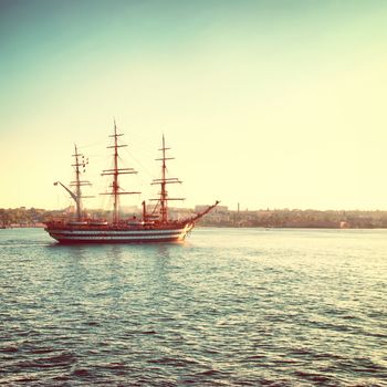 Beautiful sailing vessel in the sea comes into bay