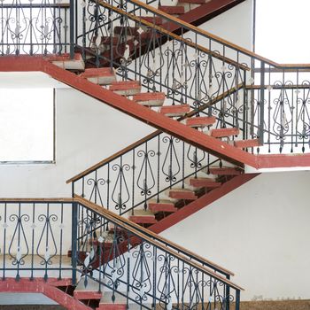 Ramp and staircases that turns inside a building, details of modern urban house