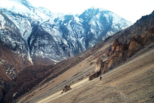 View of Himalayas mountains from Annapurna trek. Man standing on the path