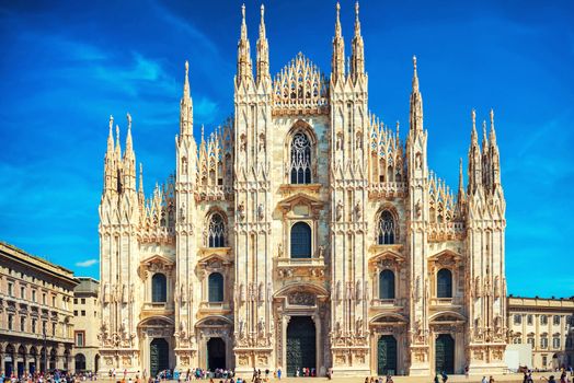 Daytime view of famous Milan Cathedral (Duomo di Milano) on piazza in Milan, Italy