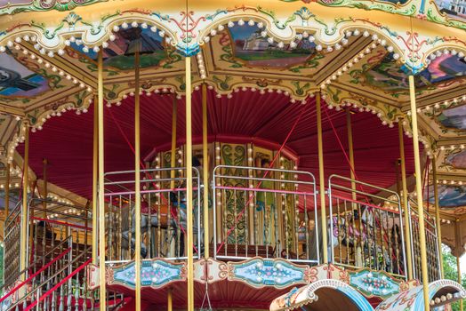 Children carousel with horses on a carnival Merry Go Round.