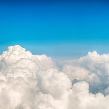 Blue fluffy clouds and sky. Natural background