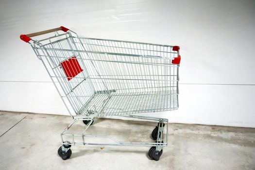 Empty shopping cart- trolley in the supermarket