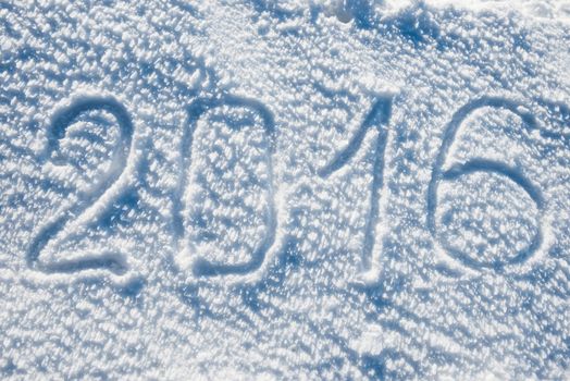 New year 2016 written on the white snow
