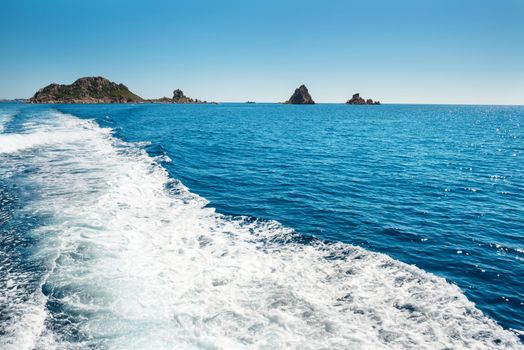 Waves on blue sea behind the speed boat water in sunny day