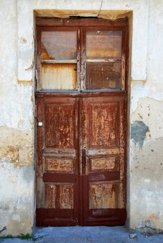 Old wooden door to the ancient house