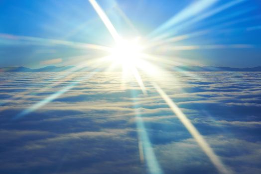 Amazing sky view from plane on blue sunset, sun and clouds