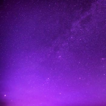 Beautiful purple night sky with many stars. Milkyway space background