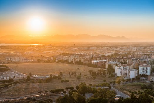 Sunset over european city. Cagliari, Sardinia, Italy.