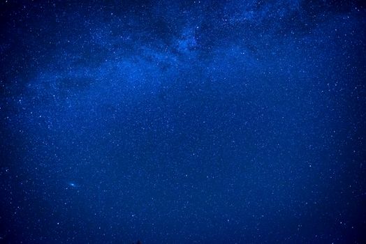 Blue dark night sky with many stars. Milkyway cosmos background