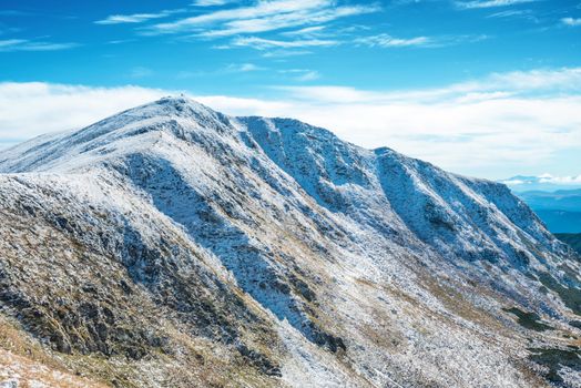 White peaks of mountains in snow. Winter landscape