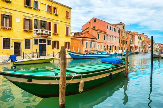 Boats on Grand Canal and Basilica Santa Maria della Salute in sunny day. Venice, Italy
