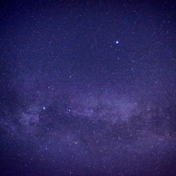 Purple dark night sky with many stars. Space milky way background