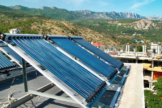 Vacuum solar cells for water heating system on the house roof