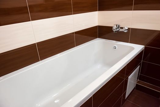 White luxury bathtub in bathroom with ceramic interior