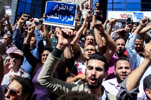 EGYPT, Cairo: Protesters cry out as thousands rally in front of the Syndicate of Journalists in Cairo on April 15, 2016 during a demonstration against the decision to hand over control of two strategic Red Sea islands, Tiran and Sanafir, to Saudi Arabia.