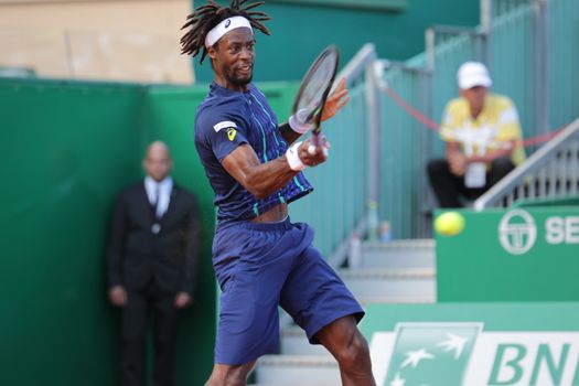 MONACO, Monte-Carlo : France's Gael Monfils hits a return to Spain's Marcel Granollers during the Monte-Carlo ATP Masters Series Tournament tennis match, on April 15, 2016 in Monaco. 