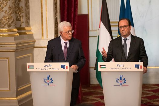 FRANCE, Paris : Palestinian President Mahmoud Abbas (L) and French President Francois Hollande (R), hold a press conference after their meeting at the Elysee Palace in Paris, on April 15, 2016.Palestinian president Mahmud Abbas holds talks with French President Francois Hollande during his international tour seeking a UN resolution on Israeli settlements.