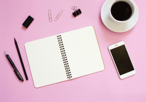 Creative flat lay mockup design of workspace desk with blank notebook, smartphone, coffee, stationery with copy space background

