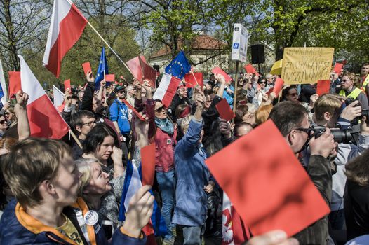 POLAND, Warsaw: Protesters wave flags and banners during a protest in Warsaw, Poland against the new Police Act and State Surveillance Law on April 16, 2016.The Police Act allows investigators to access specific private information. The new regulations have been set by the parliament where the vast majority of members are from Jarosław Kaczyński's party Law and Justice (PiS).The demonstrators rallied in front of the Chancellery of the Prime Minister