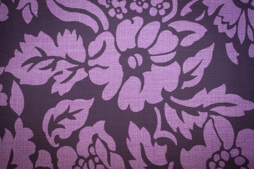 Rustic canvas fabric texture in purple color.