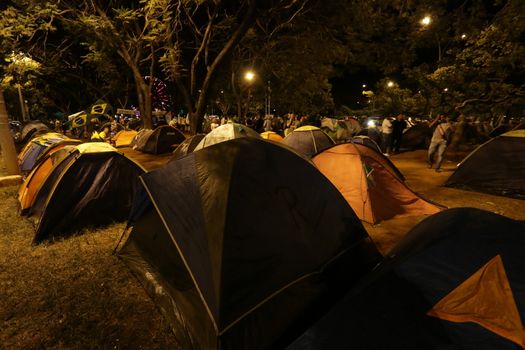 BRAZIL, Brasília : Activists supporting the impeachment of President Dilma Rousseff, set up camp in the Sarah Kubitschek City Park in Brasilia on April 16, 2016.Saturday was the second day of the debate on the impeachment of President Dilma Rousseff in Brazil's lower house of Congress, ahead of a Sunday vote on whether or not to pursue the process. 