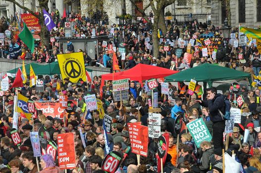 UNITED KINGDOM, London: Protesters hold placards as ten of thousands march and protest against the Tories government and demanded David Cameron's resignation in Trafalgar square in London on April 16, 2016. Protesters descended to London in hundreds of coaches from all over the UK to take part in this anti-austerity protest.