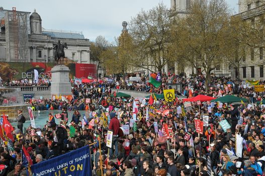 UNITED KINGDOM, London: Protesters hold placards as ten of thousands march and protest against the Tories government and demanded David Cameron's resignation in Trafalgar square in London on April 16, 2016. Protesters descended to London in hundreds of coaches from all over the UK to take part in this anti-austerity protest.