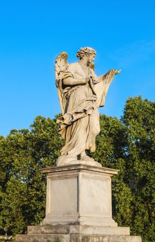 Ancient marble sculpture of angel on the Saint Angel Bridge. Rome, Italy.