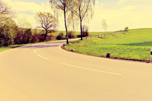 Winding Paved Road in the Swiss Alps, Vintage Style Toned Picture