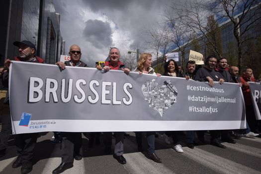 BELGIUM, Brussels : Protesters hold a banner reading Brussels as they take part in the peaceful march #Tousensemble - #Sameneen against terrorism and hate in the city centre of Brussels on April 17, 2016.At least a thousand people paid a tribute to the victims of the terror attack of March 22 in the streets of Brussels during the peaceful march organised by citizens associations. 