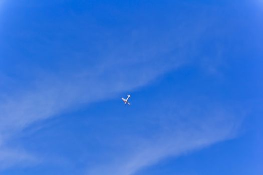 Photo of flying military plane in blue sky