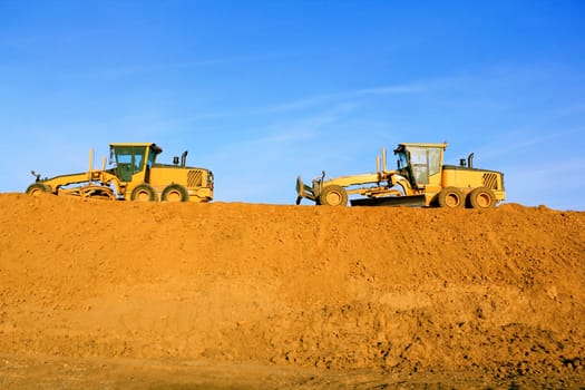 Photo of rural landscape with agricultural machine